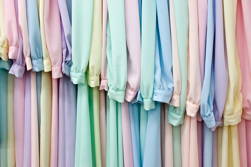 A rack of pastel colored dresses in the sewing shop at the FLDS church\\'s YFZ ranch outside of Eldorado, Texas.
